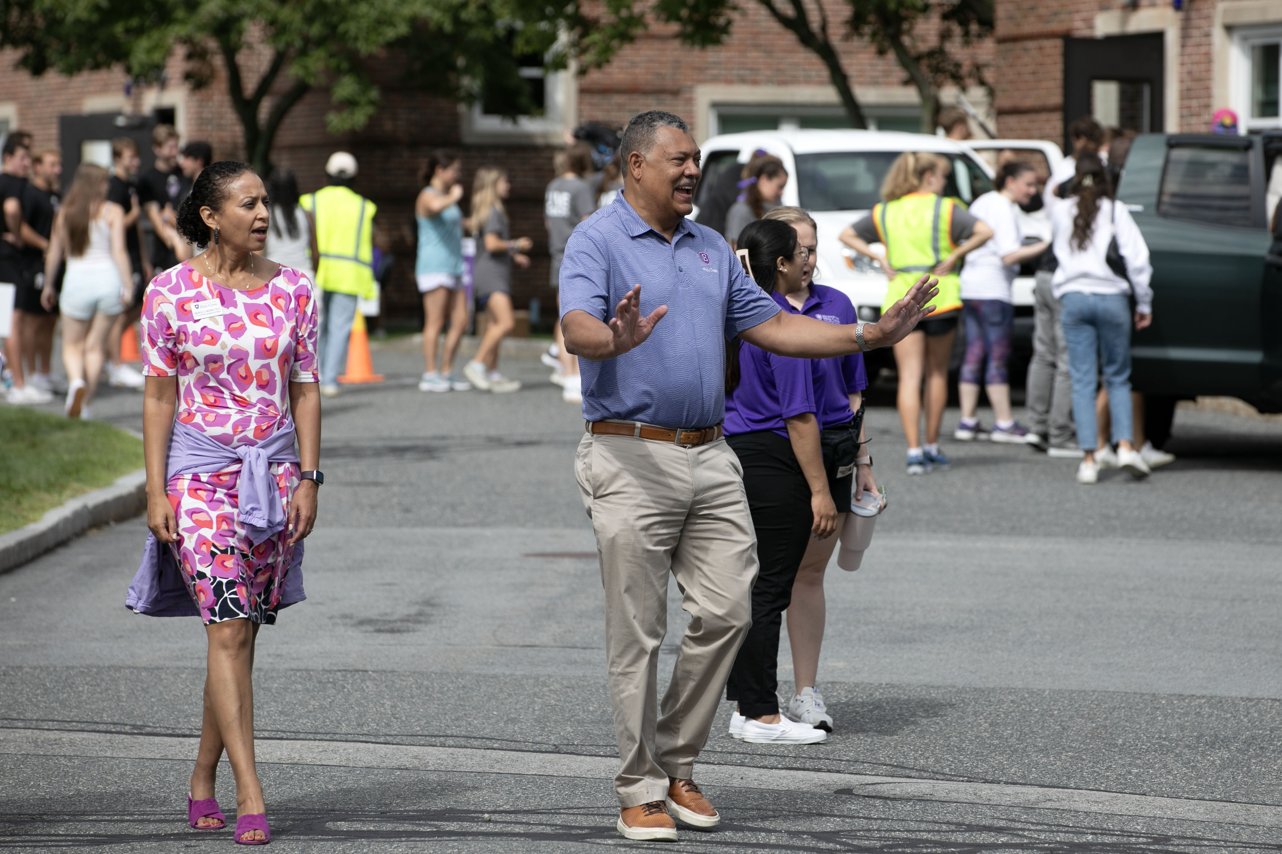 Vince Rougeau standing a road smiling a students