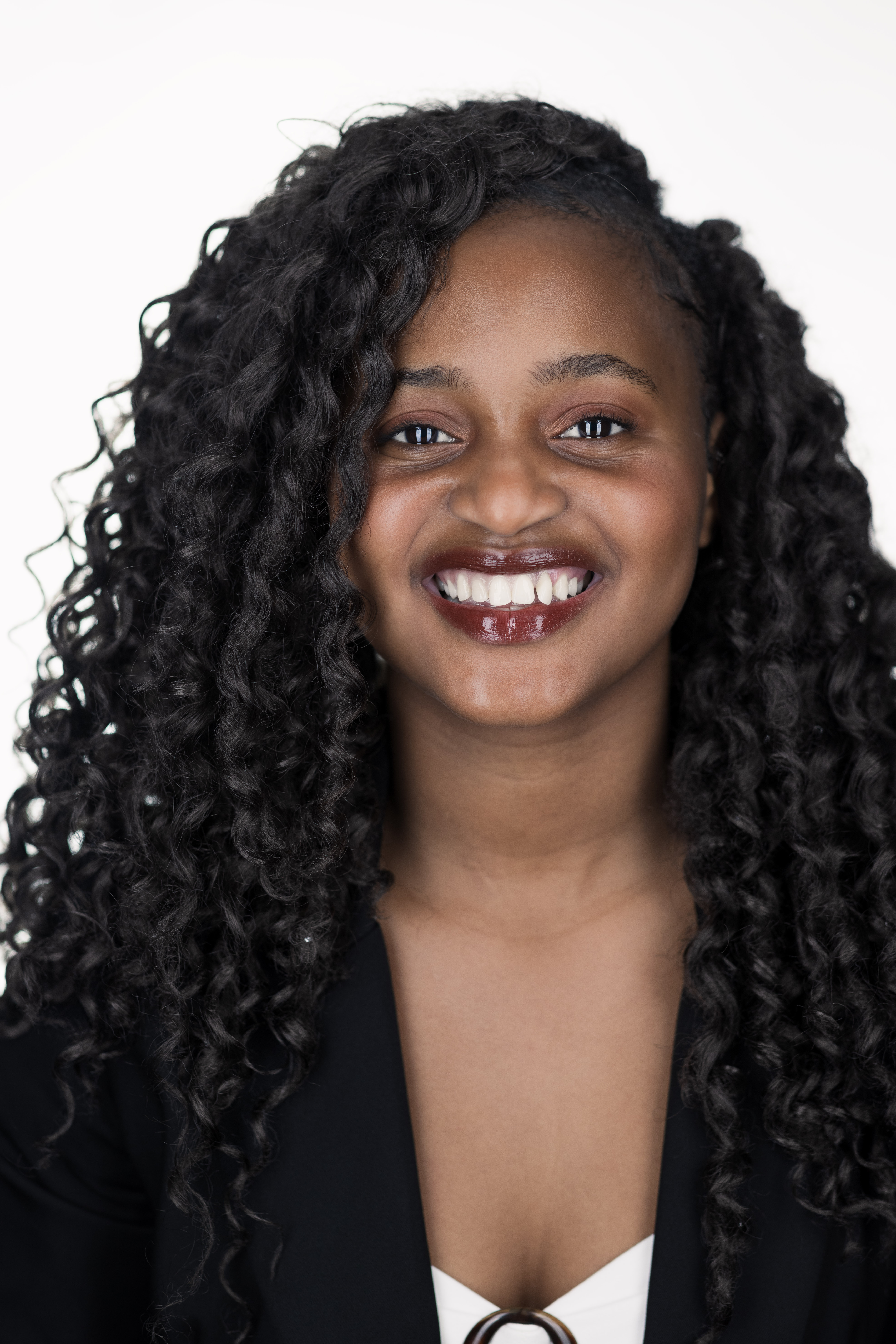 A portrait of a college student with a white background