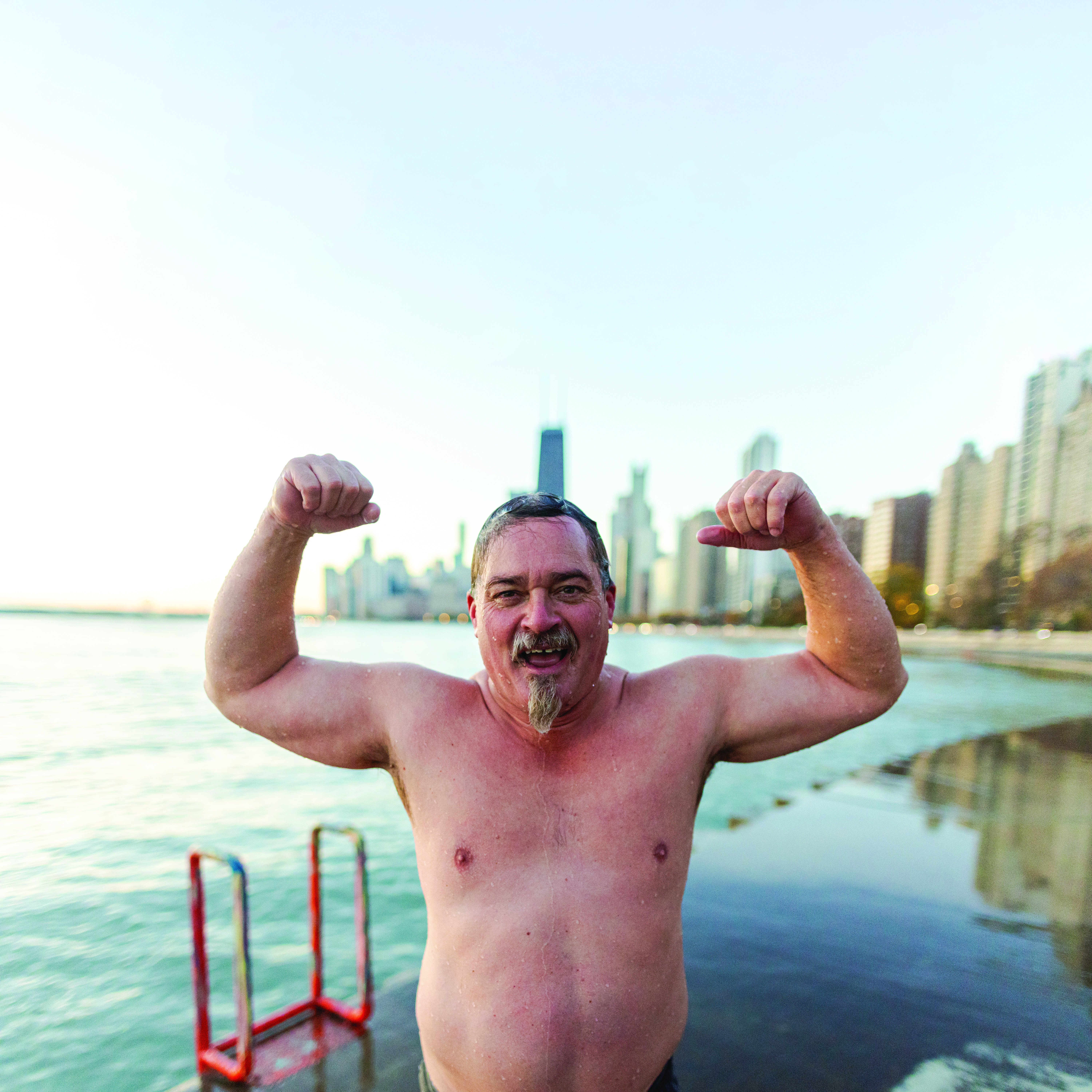 Ban in bathing suit flexes his muscles