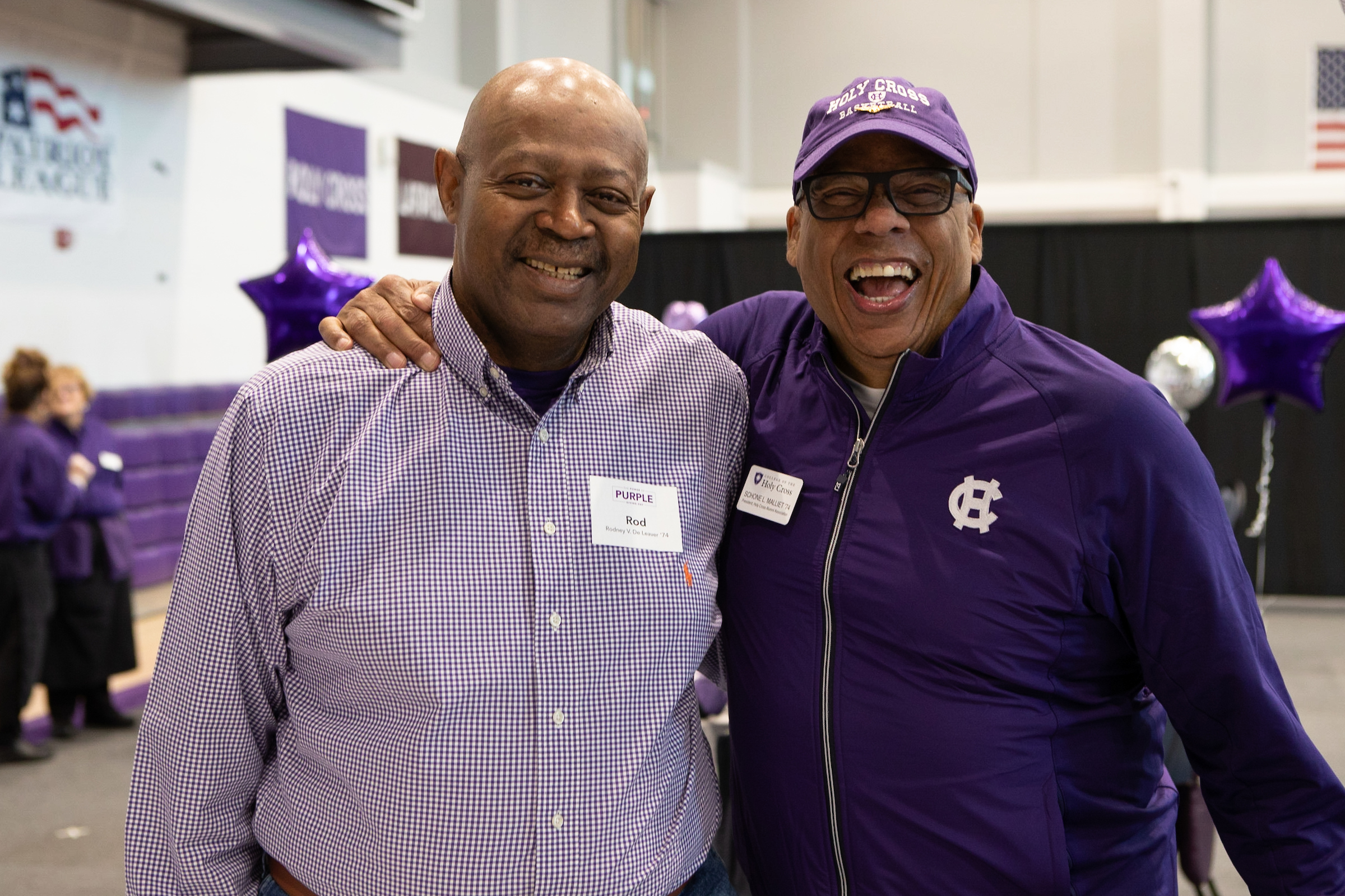 Two alumni at a welcome reception for Homecoming 2024