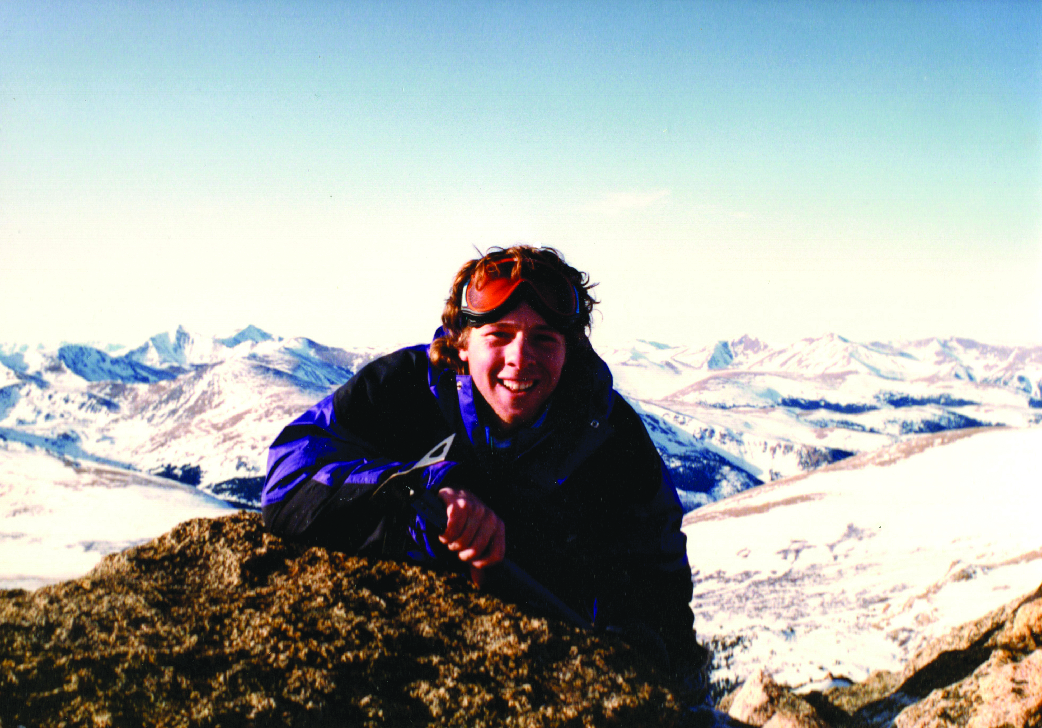 Man on snowy mountaintop