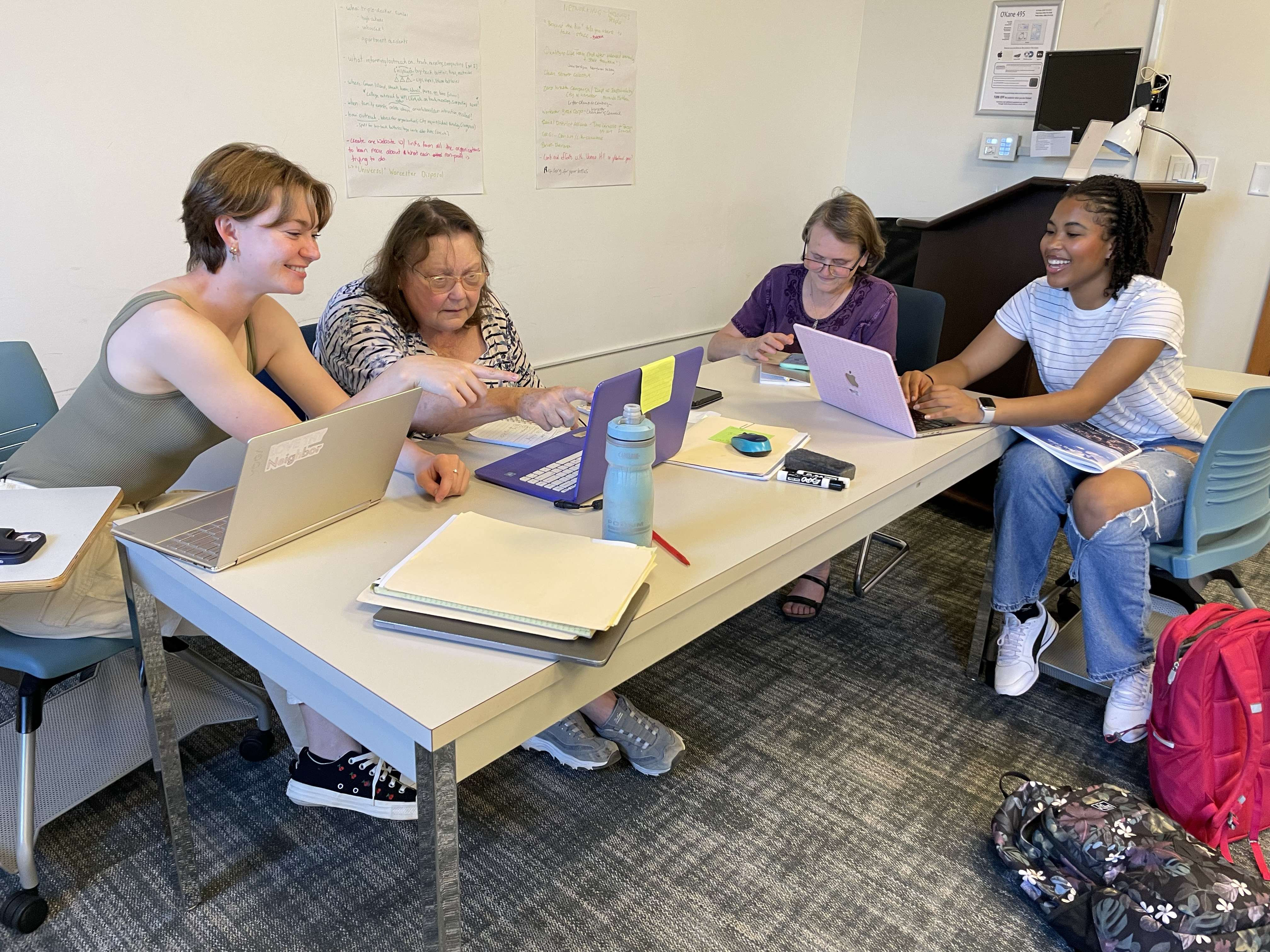 Four people working at a table