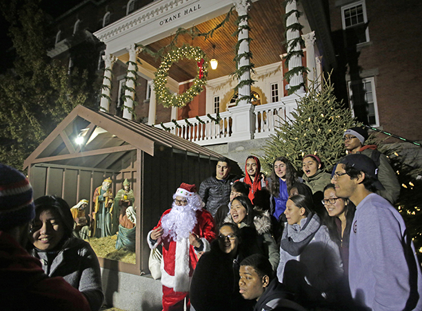 Students gather to take photos with Santa during the Christmas tree lighting ceremony.