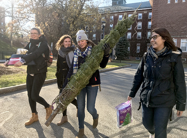 With decorations in hand, roommates walk back to their residence hall to make their room festive for the holiday season.