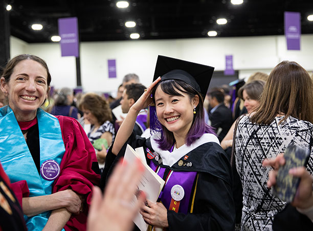 Students celebrate at the reception following the ceremony.