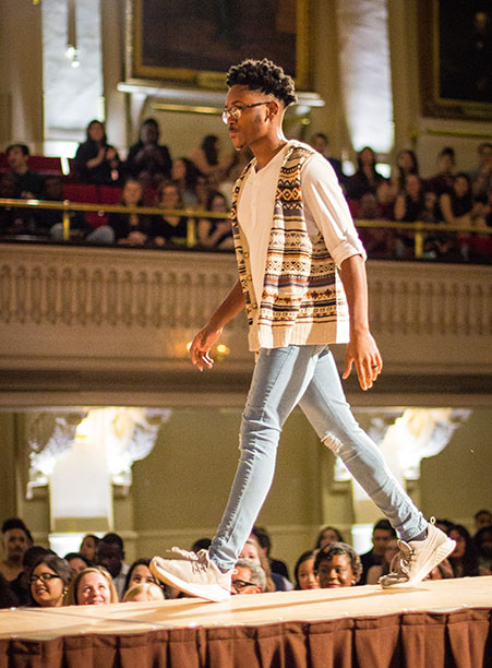 A student walks down the catwalk during the BSU 20th Annual Fashion Show.