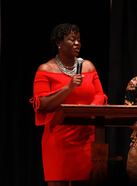 Fashion Show Founder Cheryl Yiadom '02 speaks to the audience during the BSU 20th Annual Fashion Show.