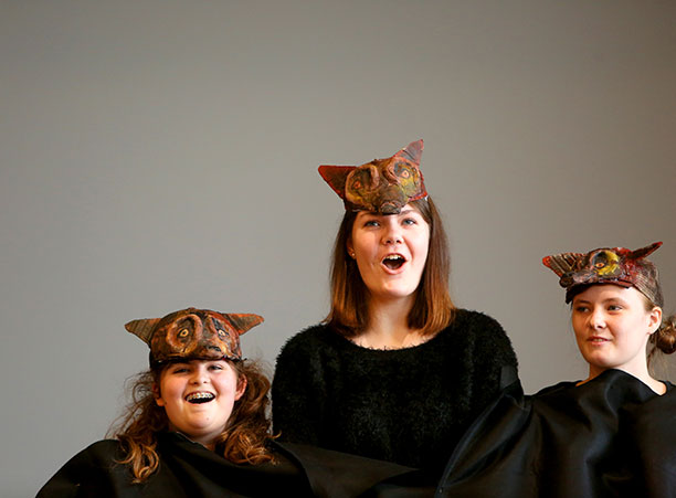 Three students from Ursuline Academy dress up as the mythical beast Cerberus.