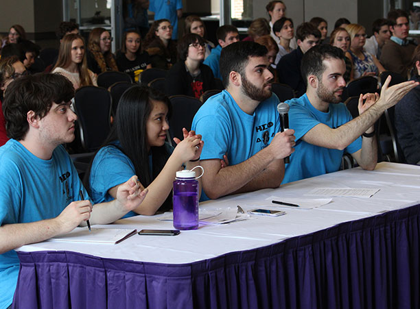 A panel of Holy Cross students moderate the final round of Certamen