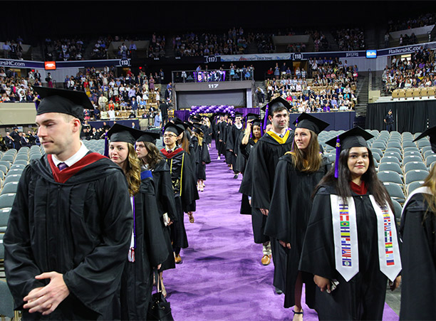 Students process into the DCU Center.
