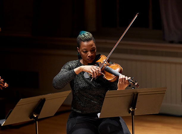 A woman plays the violin