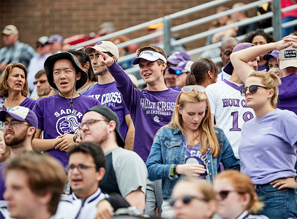 crowds cheer for Holy Cross football