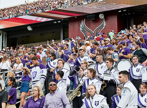 crowds cheer for Holy Cross football