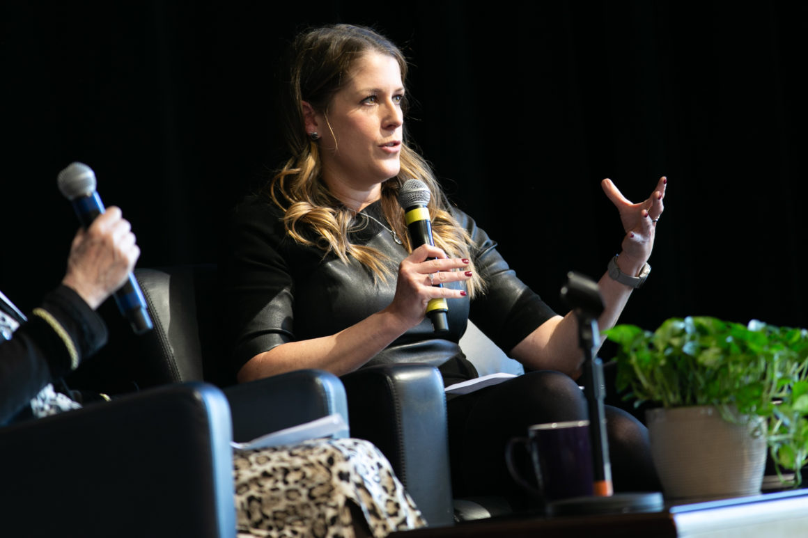 Women holding a microphone talking
