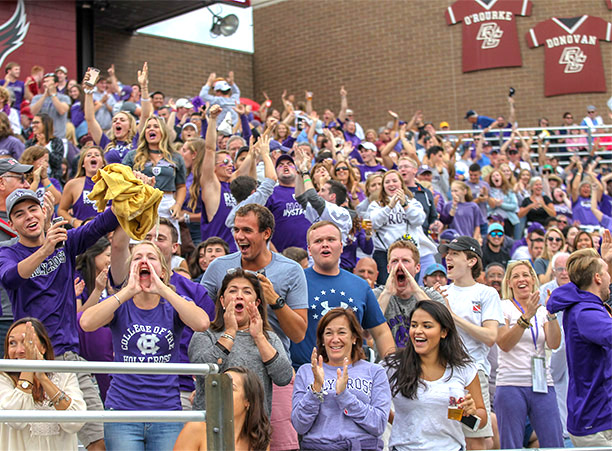 crowds cheer for Holy Cross football