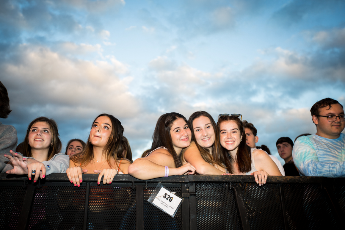 Students pose together for a photo at a campus concert.