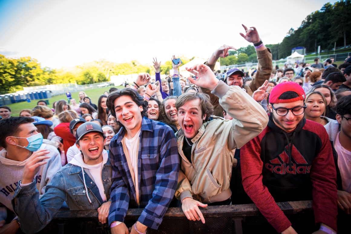 Students pose together for a photo at a campus concert.