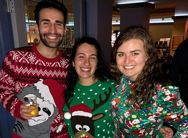 Students celebrate the holiday season — and near end of the semester — with an ugly sweater contest at the College pub..