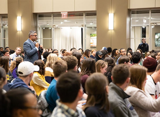 Amit Taneja, Dean for Diversity, Equity and Inclusion, stands in the crowd to ask a question