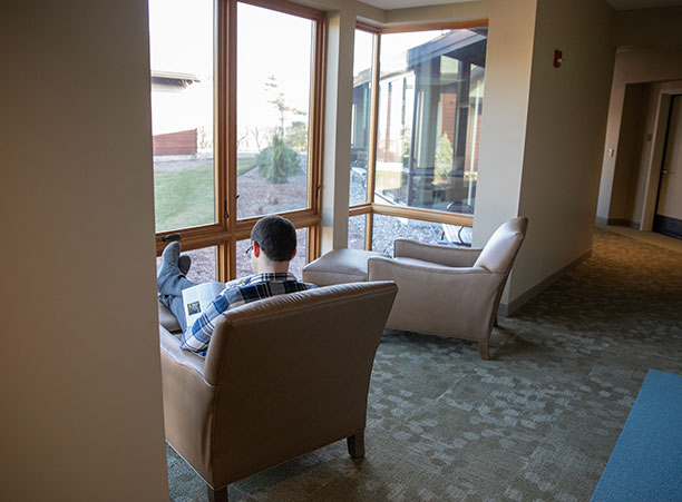 A student reads in a chair