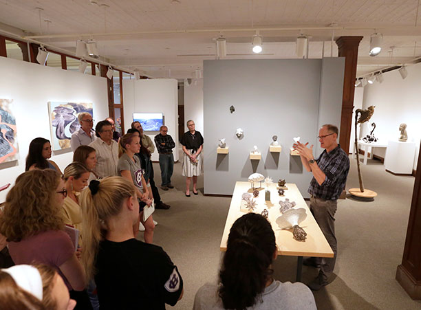 A group gathered in the Iris and B. Gerald Cantor Art Gallery