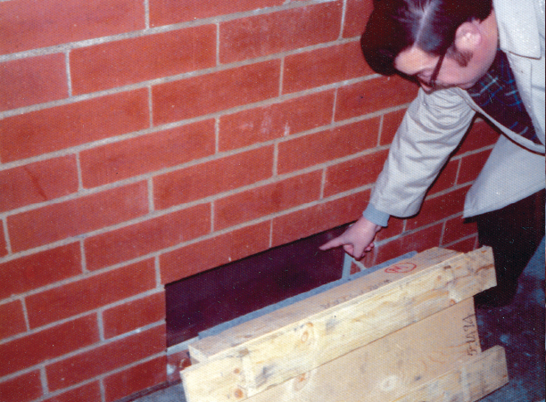 In another photo from that snowy evening, the back of the print reads &quot;Fr. (Vincent) Lapomarda points to time box, January 1976.&quot;