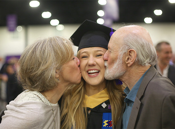 Students celebrate with their friends and family at the reception following commencement.