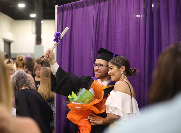 Students celebrate with their friends and family at the reception following commencement.