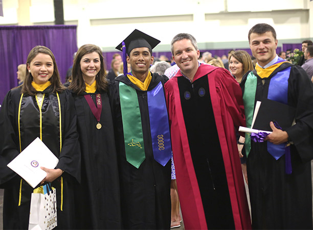 Students celebrate with their friends and family at the reception following commencement.