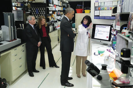 Fauci discussing Ebola research with President Barack Obama as NIAID Director Fauci and Health and Human Services Secretary Sylvia Burwell look on.