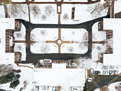 An aerial image of a snow covered college campus
