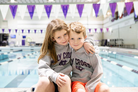 Children of alumni sporting their Holy Cross gear