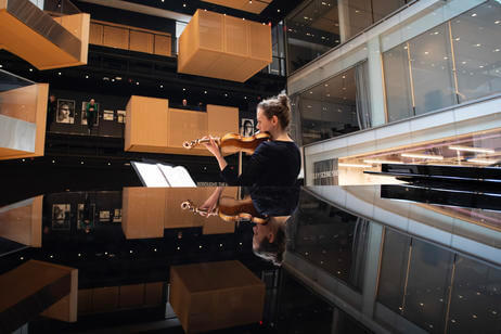 Violin performance in the Beehives at the Prior Performing Arts Center