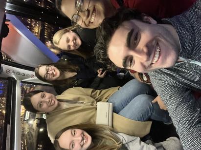 Group of college students taking a selfie.