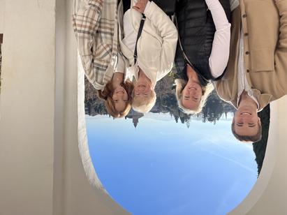 Kevin Hamilton and his family standing in an archway in Spain