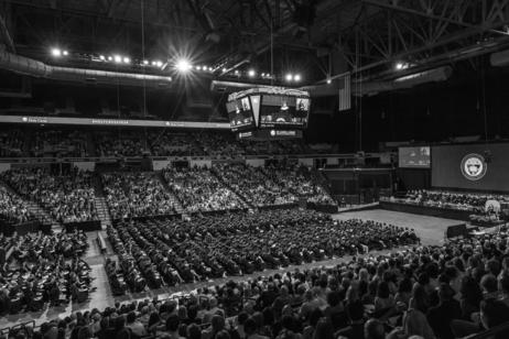 A high angle view of commencement exercises at the DCU Center in Worcester, MA.