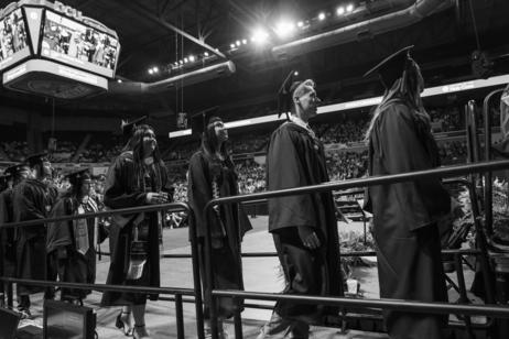 Graduates lined up to receive diplomas.