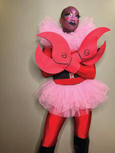 André Isaacs in a costume wearing a pink skirt to appear like HIM from "The Powerpuff Girls"