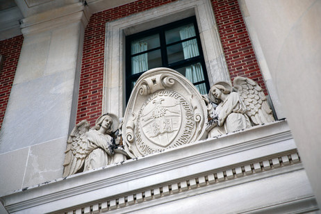The College seal above the library's doors