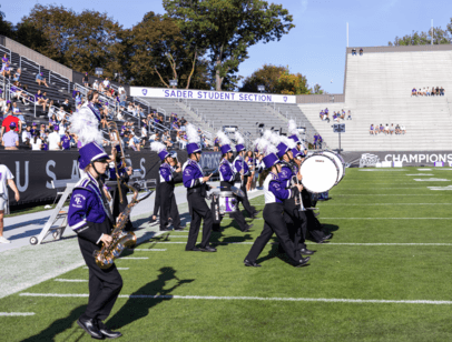 Marching band walking onto football field