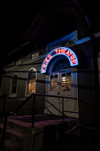 The Fries Theatre sign at night