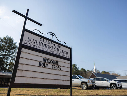 Church sign that reads "Welcome Holy Cross"