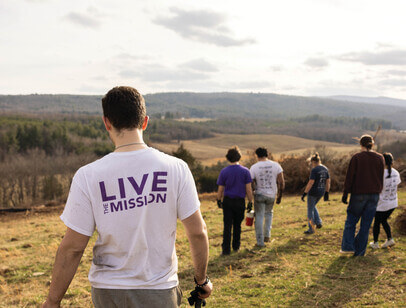 A group of students walking down a hill