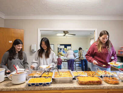 Students serving themselves lunch