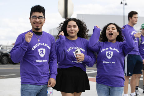 Students cheering as the procession makes its way to the Hart Center at the Luth Athletic Complex. Photo by Matt Wright