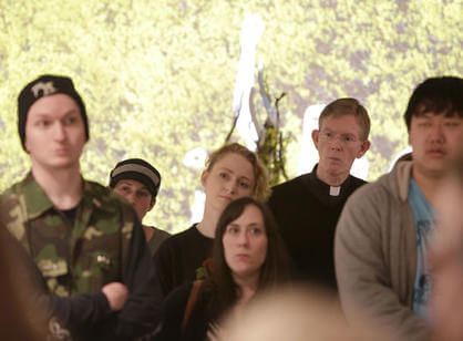 Fr. Boroughs attends the senior studio art major exhibition, “re,” in the Cantor Art Gallery during the Academic Conference.