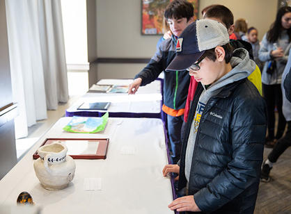 Archbishop of Boston Seán Cardinal O'Malley, O.F.M. Cap. stands with College President Rev. Philip L. Boroughs, S.J. during Mass.