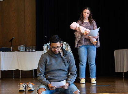 An alumnus watches the BSU 50th anniversary documentary.