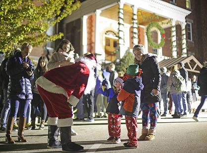 Santa takes time to chat with children at the College’s annual Christmas tree lighting ceremony.