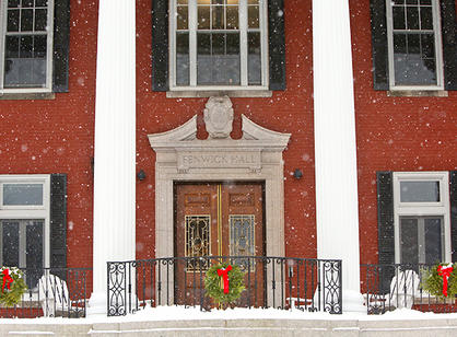 Fenwick Porch is made even more beautiful by falling snow and festive wreaths.